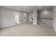 Spacious room featuring plush carpet, neutral walls, and a staircase to other spaces at 3438 Great Egret Dr, Johns Island, SC 29455