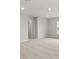 Well-lit room featuring plush carpet, neutral walls, and a hallway to other spaces at 3438 Great Egret Dr, Johns Island, SC 29455