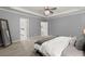 Comfortable main bedroom featuring a plush carpet, ensuite bathroom, and neutral paint at 3438 Great Egret Dr, Johns Island, SC 29455