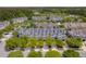 Aerial view of townhomes and mature trees in a well-maintained community with manicured lawns at 4020 Conant Rd, Mount Pleasant, SC 29466