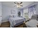 Comfortable bedroom featuring a ceiling fan, natural light, and relaxing blue color scheme at 4020 Conant Rd, Mount Pleasant, SC 29466