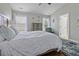 Comfortable bedroom boasts a plush bed, accent chair, and bright, natural light from the windows at 4020 Conant Rd, Mount Pleasant, SC 29466