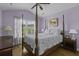 Bedroom featuring hardwood floors, four-post bed, and natural light at 4020 Conant Rd, Mount Pleasant, SC 29466