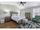 Beautiful bedroom featuring a coordinated furniture set, ceiling fan, and a patterned area rug at 4020 Conant Rd, Mount Pleasant, SC 29466