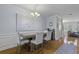 Dining room features a table and four chairs, modern chandelier, and access to the kitchen at 4020 Conant Rd, Mount Pleasant, SC 29466