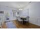 Dining room features a table and four chairs, modern chandelier, and access to the kitchen at 4020 Conant Rd, Mount Pleasant, SC 29466