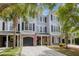 Charming townhome with a brick-accented facade, attached garage, and welcoming curb appeal at 4020 Conant Rd, Mount Pleasant, SC 29466