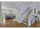 Spacious entry showcasing the staircase, hardwood floors, and an open-concept design at 4020 Conant Rd, Mount Pleasant, SC 29466