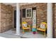 Cozy front porch with decorative brickwork, and cheerful yellow seating at 4020 Conant Rd, Mount Pleasant, SC 29466