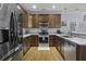 Modern kitchen features stainless steel appliances, granite counters, wood floors, and ample cabinet space at 4020 Conant Rd, Mount Pleasant, SC 29466
