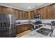 Modern kitchen features stainless steel appliances, granite counters, wood floors, and ample cabinet space at 4020 Conant Rd, Mount Pleasant, SC 29466