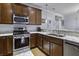 Modern kitchen features stainless steel appliances, granite counters, wood floors, and ample cabinet space at 4020 Conant Rd, Mount Pleasant, SC 29466