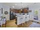 Modern kitchen features stainless steel appliances, granite counters, a breakfast bar, and hardwood floors at 4020 Conant Rd, Mount Pleasant, SC 29466