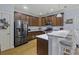 Modern kitchen features stainless steel appliances, granite counters, a breakfast bar, and hardwood floors at 4020 Conant Rd, Mount Pleasant, SC 29466