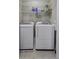 Functional laundry room with washer, dryer, and wire shelving for storage at 4020 Conant Rd, Mount Pleasant, SC 29466