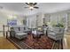 Comfortable living room features hardwood floors, ample seating, and lots of natural light at 4020 Conant Rd, Mount Pleasant, SC 29466
