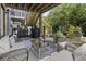 Relaxing patio with comfortable seating, a glass-topped table, and access to the home's exterior at 4020 Conant Rd, Mount Pleasant, SC 29466