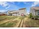 Large backyard with a well-maintained lawn and outdoor patio furniture at 403 Fox Sparrow Ct, Summerville, SC 29486