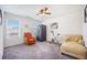 Bright bedroom with natural light, an orange chair, and exercise equipment at 403 Fox Sparrow Ct, Summerville, SC 29486