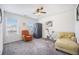 Bright bedroom with a ceiling fan, two chairs, and two large windows that provide plenty of natural light at 403 Fox Sparrow Ct, Summerville, SC 29486