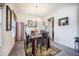 Cozy dining room featuring a dark wood table, carpet and an ornate rug, creating an inviting space at 403 Fox Sparrow Ct, Summerville, SC 29486