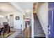 Inviting entryway with stairs, hardwood floors, and a view into the living room and dining area at 403 Fox Sparrow Ct, Summerville, SC 29486