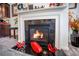 Close-up of a modern fireplace with a decorative mantel and hearth, perfect for creating a warm and inviting atmosphere at 403 Fox Sparrow Ct, Summerville, SC 29486