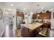 Spacious kitchen with stainless steel appliances, granite island, and wood floors, perfect for cooking and entertaining at 403 Fox Sparrow Ct, Summerville, SC 29486