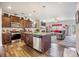 Open-concept kitchen with a central island, stainless steel appliances, and seamless flow into the adjacent living area at 403 Fox Sparrow Ct, Summerville, SC 29486