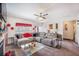 Spacious living room with comfortable seating, modern ceiling fan, and lots of natural light at 403 Fox Sparrow Ct, Summerville, SC 29486