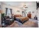 Comfortable main bedroom with a ceiling fan, soft lighting, and ample space for relaxation and rest at 403 Fox Sparrow Ct, Summerville, SC 29486