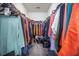 Spacious walk-in closet with ample hanging space and shelving, perfect for organizing clothes and accessories at 403 Fox Sparrow Ct, Summerville, SC 29486