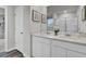 Bright bathroom with a double sink vanity, framed art, and walk-in shower with glass door at 4115 Rising Tide Dr, Summerville, SC 29485