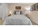 Cozy bedroom with neutral walls, framed art, and a plush bed with decorative pillows at 4115 Rising Tide Dr, Summerville, SC 29485