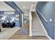Inviting entryway with hardwood floors, a staircase, and access to other rooms in the home at 4115 Rising Tide Dr, Summerville, SC 29485