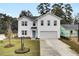 Charming two-story home with attached garage, manicured landscaping, and a welcoming front entrance at 4115 Rising Tide Dr, Summerville, SC 29485