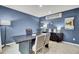 Bright home office featuring a modern desk, gray seating, and stylish decor for a productive atmosphere at 4115 Rising Tide Dr, Summerville, SC 29485
