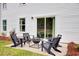 Backyard patio with seating around a fire pit at 4115 Rising Tide Dr, Summerville, SC 29485