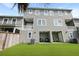 This unit's backyard has a lawn and patio with shade, perfect for relaxing and outdoor entertainment at 4143 Rigsby Ln, Charleston, SC 29414
