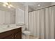 Bright bathroom featuring a shower/tub combo with neutral colored shower curtain at 4143 Rigsby Ln, Charleston, SC 29414