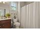 Bright bathroom with a shower and white curtain at 4143 Rigsby Ln, Charleston, SC 29414