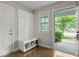 Charming entryway featuring a coat rack with a bench, shoe storage, and a view to the exterior at 4143 Rigsby Ln, Charleston, SC 29414