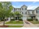 Beautiful townhome with a well-maintained lawn, shrubbery, and a private one-car garage at 4143 Rigsby Ln, Charleston, SC 29414