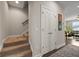 Hallway with staircase, natural light, and a double door at 4143 Rigsby Ln, Charleston, SC 29414