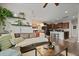 Open-concept living room and kitchen featuring modern decor, wood flooring, and neutral color palette at 4143 Rigsby Ln, Charleston, SC 29414