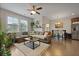 Bright and airy living room featuring a cozy sectional sofa, stylish coffee table, and great natural light at 4143 Rigsby Ln, Charleston, SC 29414