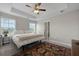 Main bedroom featuring a tray ceiling, carpet, and neutral tones at 4143 Rigsby Ln, Charleston, SC 29414