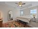 Main bedroom featuring a tray ceiling, carpet, and natural light at 4143 Rigsby Ln, Charleston, SC 29414