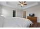 Main bedroom featuring a tray ceiling, carpet, and ensuite bathroom at 4143 Rigsby Ln, Charleston, SC 29414