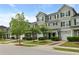 Charming townhome with manicured landscaping, a one-car garage, and a welcoming front porch at 4143 Rigsby Ln, Charleston, SC 29414